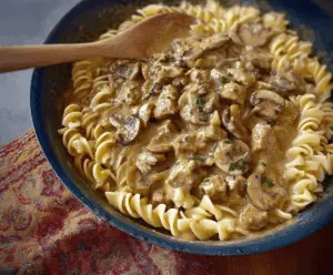 Creamy mushroom and seitan stroganoff served over noodles, featuring hearty seitan, sautéed mushrooms, and rich sauce in a delicious vegan recipe