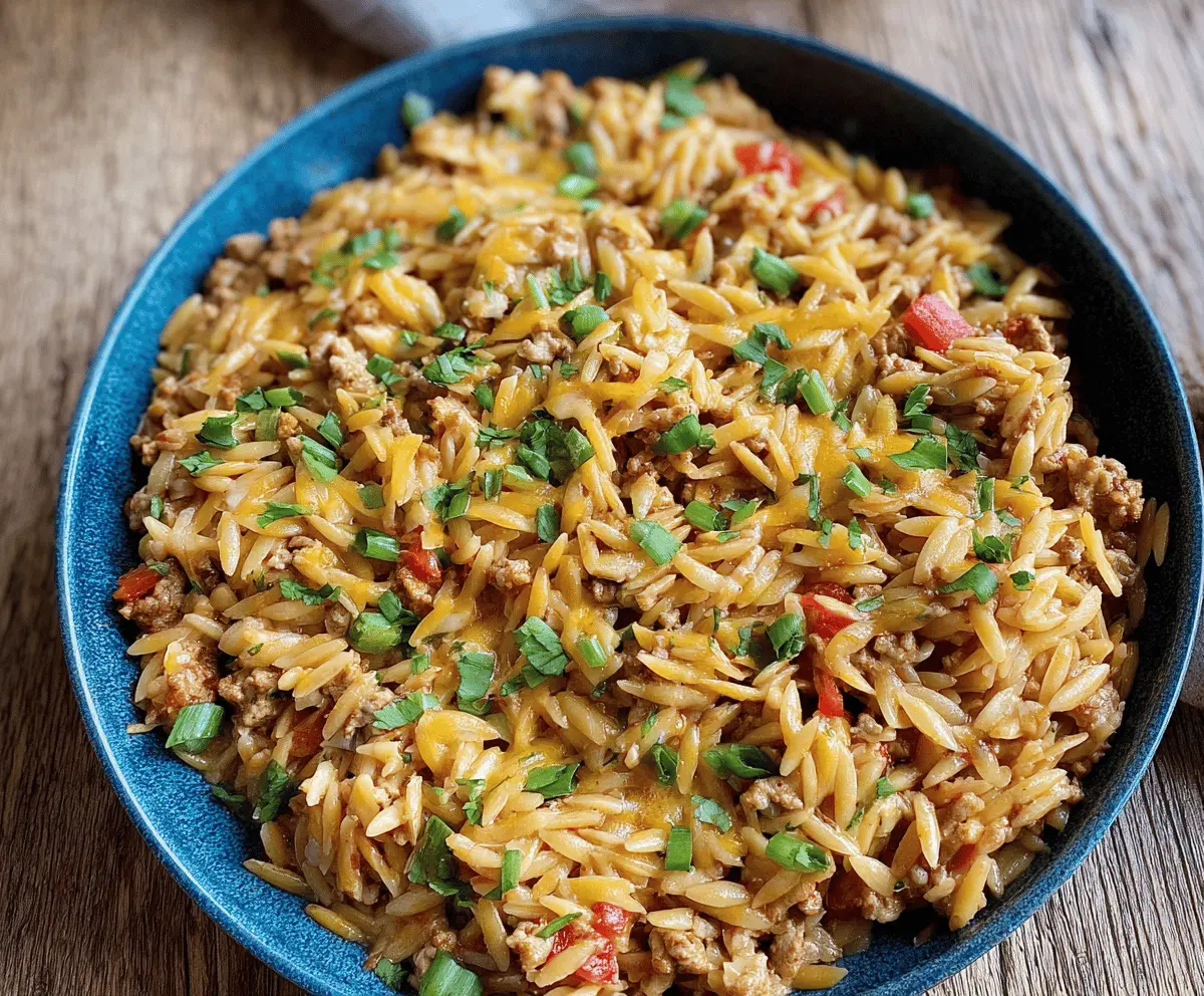 Delicious ground turkey orzo pasta dish with fresh vegetables and herbs, perfect for a quick and healthy meal.