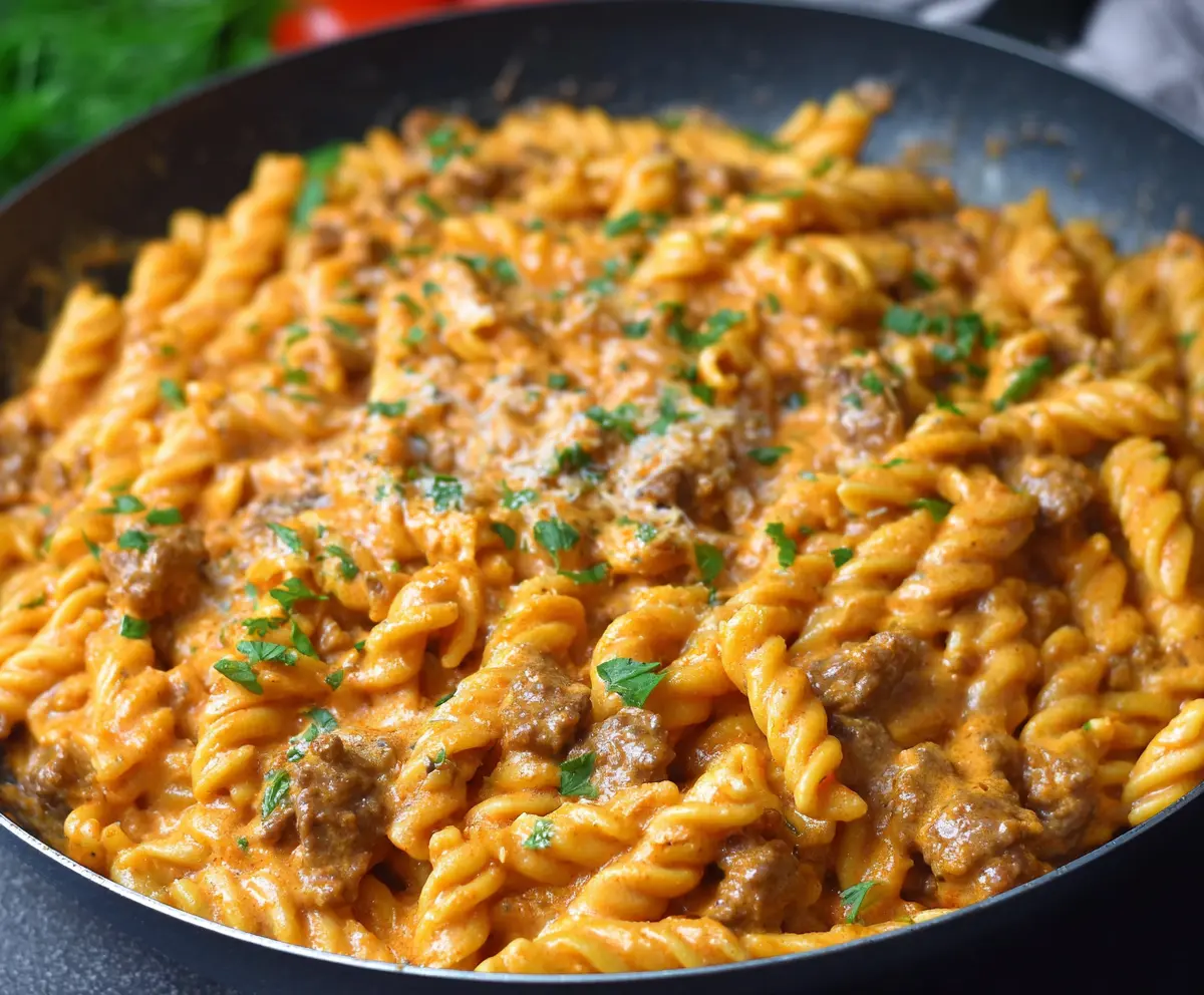 Creamy beef pasta dish featuring high protein ingredients, perfect for a quick and nutritious meal.