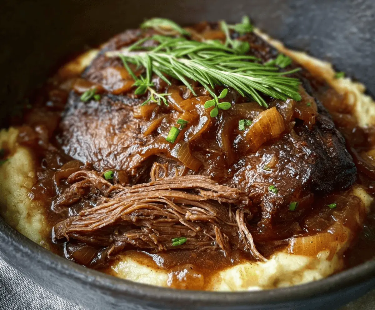 Delicious French onion pot roast with caramelized onions and tender beef in a rustic cooking pot.